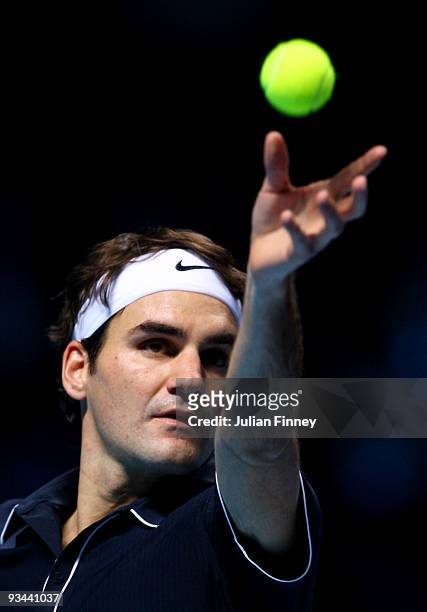 Roger Federer of Switzerland serves the ball during the men's singles round robin match against Juan Martin Del Potro of Argentina during the...