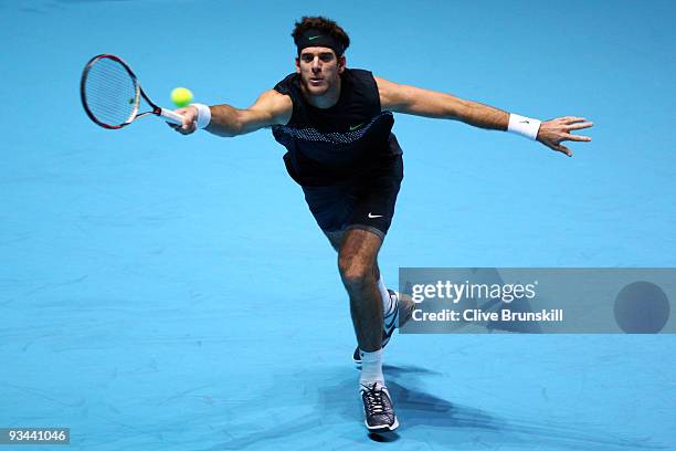 Juan Martin Del Potro of Argentina returns the ball during the men's singles round robin match against Roger Federer of Switzerland during the...