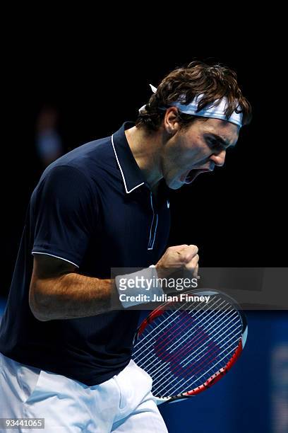 Roger Federer of Switzerland celebrates a point during the men's singles round robin match against Juan Martin Del Potro of Argentina during the...