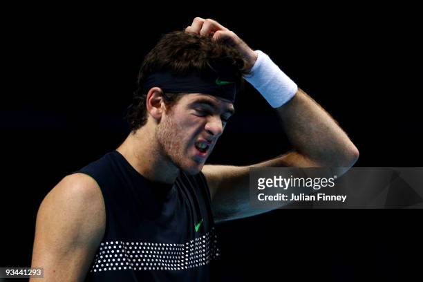 Juan Martin Del Potro of Argentina reacts during the men's singles round robin match against Roger Federer of Switzerland during the Barclays ATP...