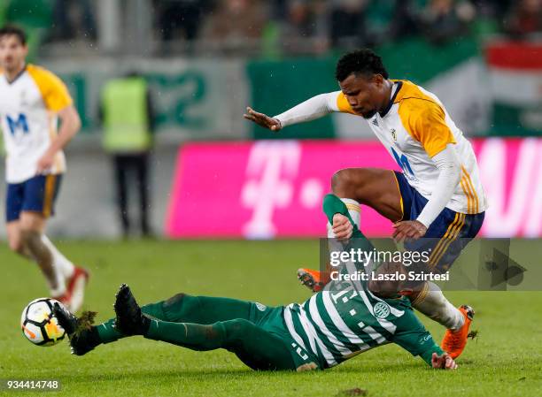 Leandro De Almeida 'Leo' of Ferencvarosi TC fights for the ball with Ezekiel Henty of Puskas Akademia FC during the Hungarian OTP Bank Liga match...