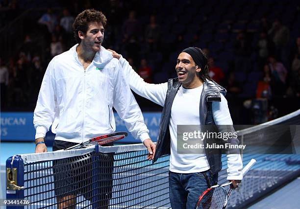 Manchester City Carlos Tevez poses for a picture with Juan Martin Del Potro of Argentina after Del Potro won his men's singles round robin match...