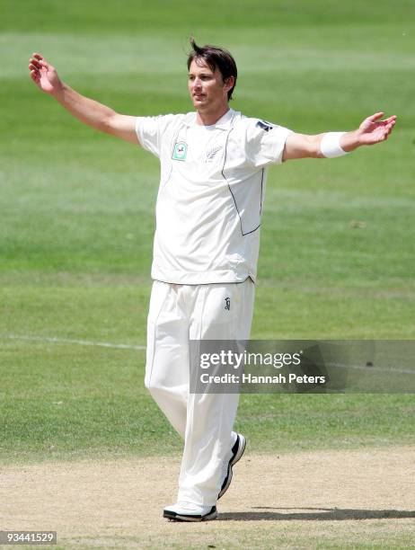 Shane Bond of New Zealand celebrates taking a five wicket haul during day four of the First Test match between New Zealand and Pakistan at University...