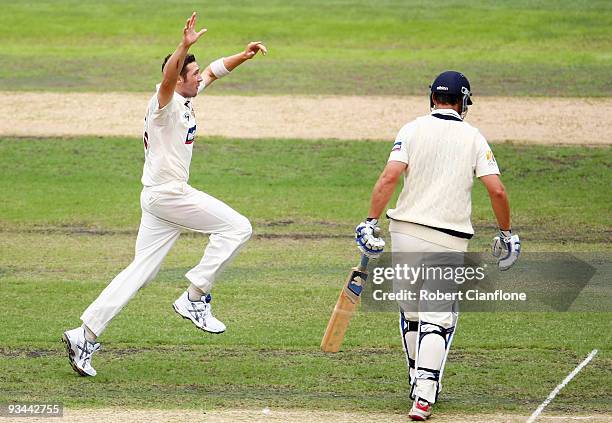 Luke Feldman of the Queensland celebrates taking the wicket of Nick Jewell of Victoria during day one of the Sheffield Shield match between the...