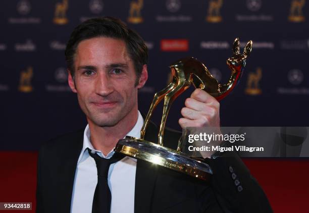 Benjamin Sadler poses with the award for the movie 'Krupp - A German Family' during the Bambi Awards 2009 show at the Metropolis Hall at the Filmpark...