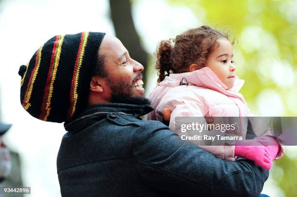 Musician Ziggy Marley and his daughter Judah Marley attend the 83rd annual Macy's Thanksgiving Day Parade on the streets of Manhattan on November 26,...