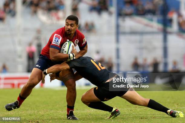 Chris Feauai-Sautia of Reds is tackled by Santiago Gonzalez Iglesias of Jaguares during a match between Jaguares and Reds as part of the fifth round...