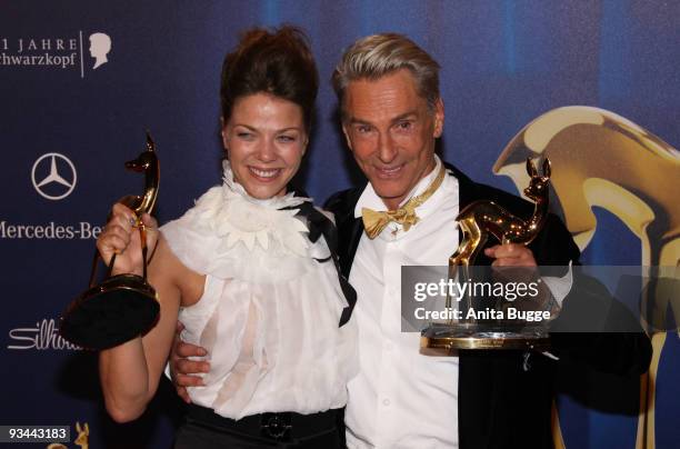 Actress Jessica Schwarz and designer Wolfgang Joop pose with their Bambi during the Bambi Awards 2009 Show at the Metropolis Hall at the Filmpark...