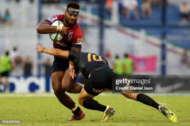 Samu Kerevi of Reds is tackled by Nicolas Sanchez during a match between Jaguares and Reds as part of the fifth round of Super Rugby at Jose...