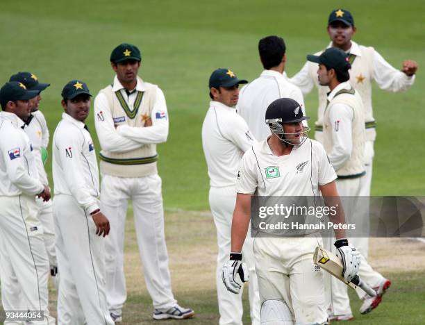 Peter Fulton of New Zealand walks off after being trapped lbw by Umar Gul of Pakistan during day four of the First Test match between New Zealand and...