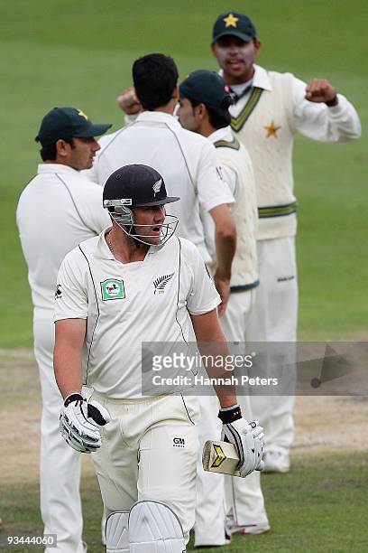 Peter Fulton of New Zealand walks off after being trapped lbw by Umar Gul of Pakistan during day four of the First Test match between New Zealand and...