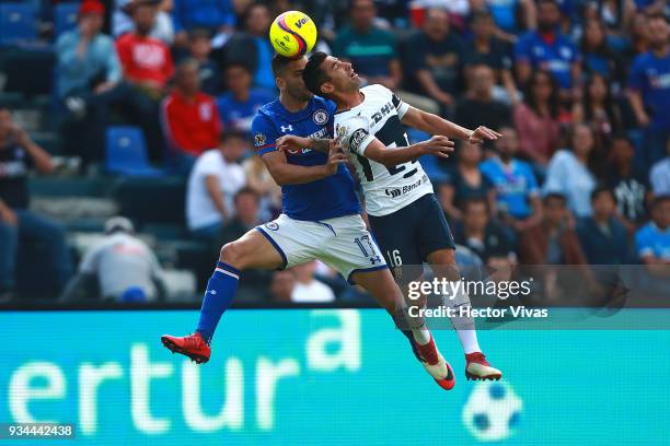 Luis Fuentes of Pumas struggles for the ball with Edgar Mendez of Cruz Azul during the 12th round match between Cruz Azul and Pumas UNAM as part of...