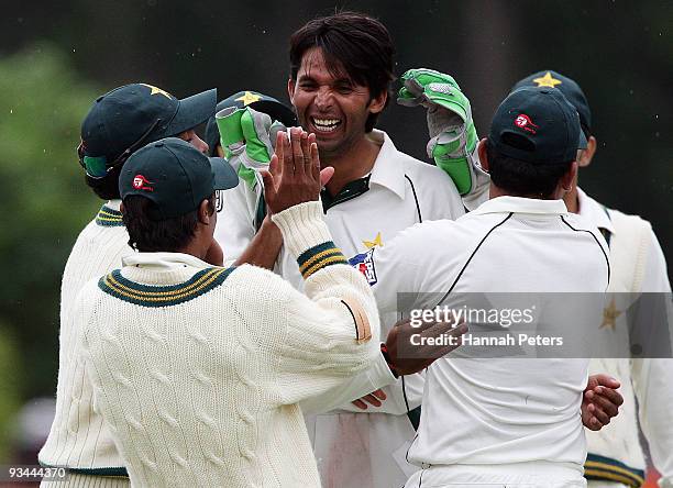 Mohammad Asif of Pakistan celebrates claiming the wicket of Brendon McCullum of New Zealand during day four of the First Test match between New...