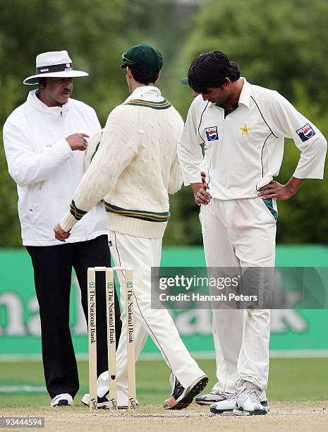 Mohammad Asif of Pakistan checks his footing after being denied a wicket from a player referral for a no ball during day four of the First Test match...