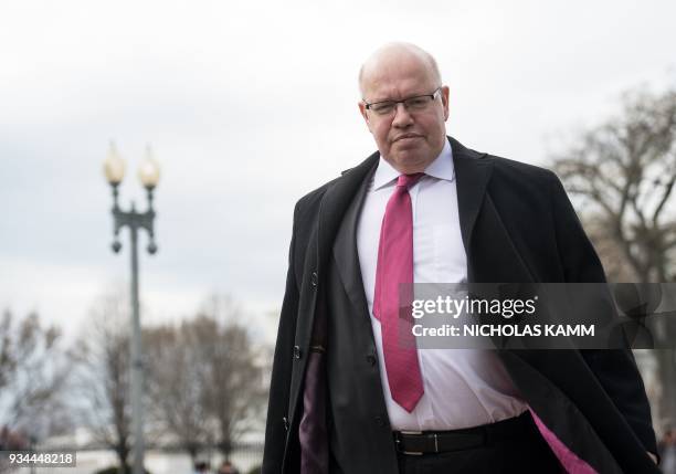 Newly named German Economy Minister Peter Altmaier arrives to speak to the press infront of the White House in Washington, DC, on March 19, 2018. /...