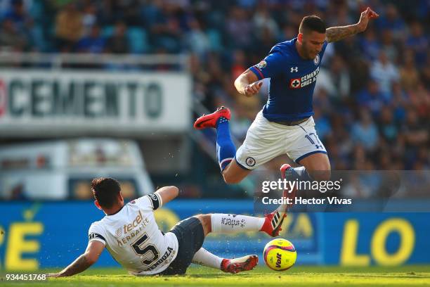 Alan Mendoza of Pumas struggles for the ball with Edgar Mendez of Cruz Azul during the 12th round match between Cruz Azul and Pumas UNAM as part of...