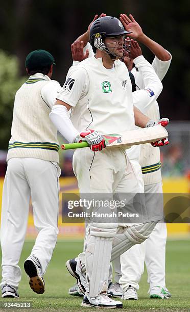 Daniel Vettori of New Zealand walks off after being dismissed by Mohammad Asif of Pakistan during day four of the First Test match between New...