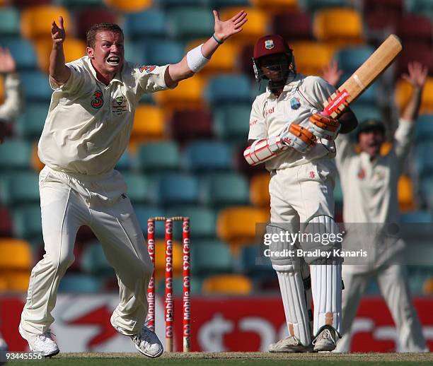 Peter Siddle of Australia takes the wicket of Shivnarine Chanderpaul of the West Indies during day two of the First Test match between Australia and...