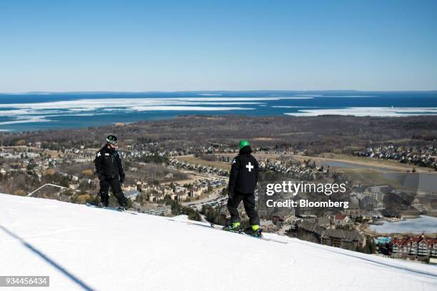 Ski patrollers are seen on a run at the Blue Mountain Resorts Holding Inc. Ski Resort in Collingwood, Ontario, Canada, on Sunday, March 4, 2018....