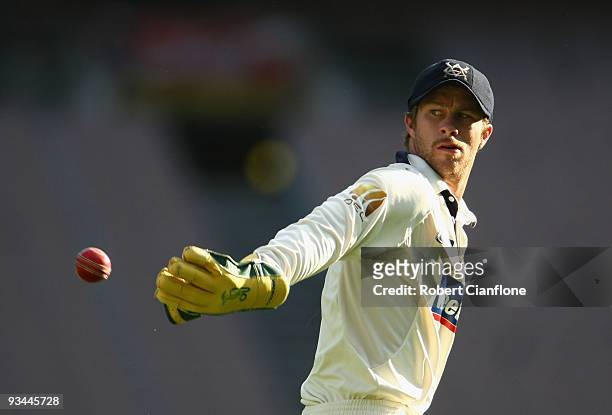 Victorian wicketkeeper Matthew Wade throws the ball to a teammate during day one of the Sheffield Shield match between the Victorian Bushrangers and...