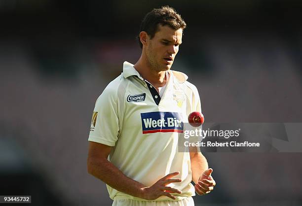 Clinton McKay of Victoria prepares to bowl during day one of the Sheffield Shield match between the Victorian Bushrangers and the Queensland Bulls at...