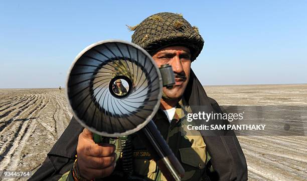 Indian Border Security Force jawans - soldiers - patrol at Border Pillar No 1175, the last international border pillar along the horizontal segment...