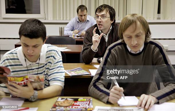 Anna MALPAS A Russian student asks a question during a tabloid journalism class run by the news weekly Zhizn , in Moscow on November 24, 2009. As...