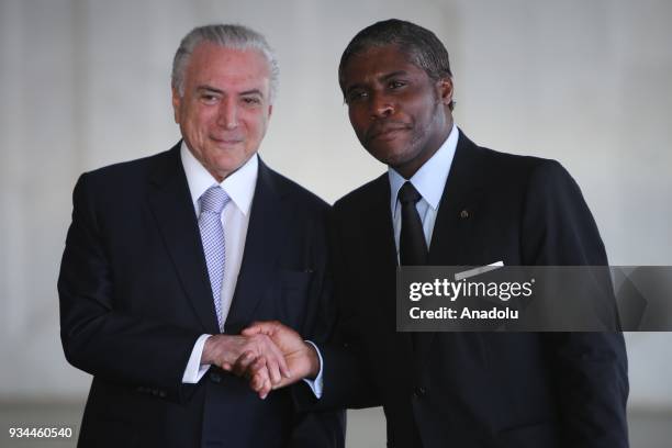 Brazil's President Michel Temer shakes hands with Vice-President of Equatorial Guinea Teodoro Obiang Mangue during the opening ceremony of the 8th...