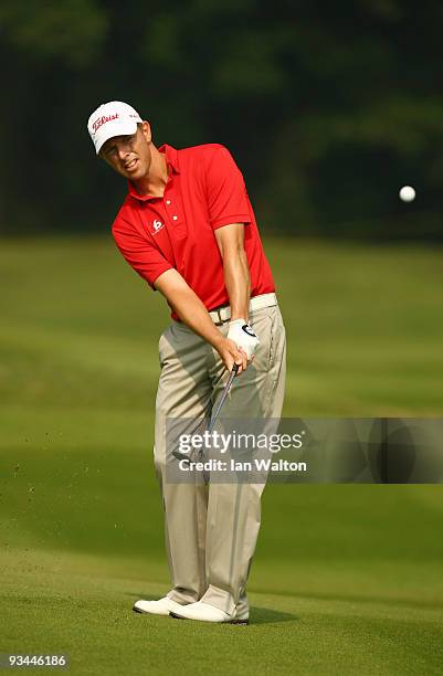 Soren Hansen of Denmark in action during the Foursome's on the second day of the Omega Mission Hills World Cup on the Olazabal course on November 27,...