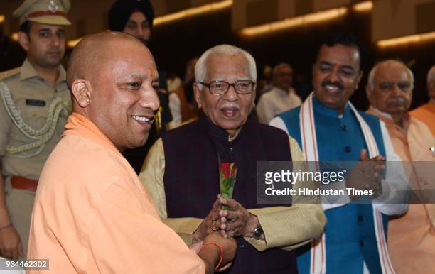 Chief Minister Yogi Adityanath welcomes Governor Ram Naik during the programme organised to mark the first anniversary of BJP goverment in Uttar...