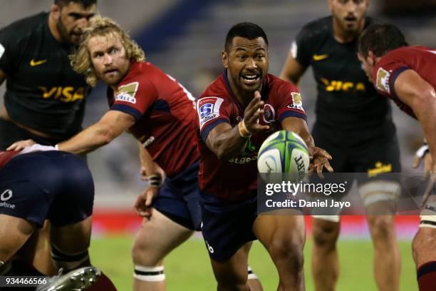 Caleb Timu of Reds passes the ball during a match between Jaguares and Reds as part of the fifth round of Super Rugby at Jose Amalfitani Stadium on...