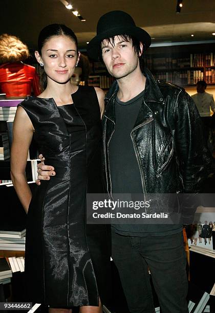 Model Caroline D'Amore and musician Bobby Alt attend the Prada book launch cocktail held at Prada on Rodeo Drive on November 13, 2009 in Beverly...
