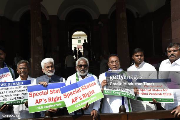 The members of YSR party stage protest demanding special status for Andhra Pradesh during the Budget Session of Parliament on March 19, 2018 in New...