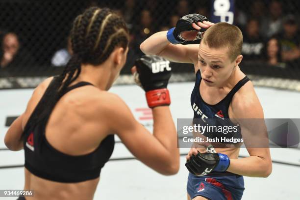 Rose Namajunas punches Joanna Jedrzejczyk of Poland in their UFC women's strawweight championship bout during the UFC 217 event inside Madison Square...