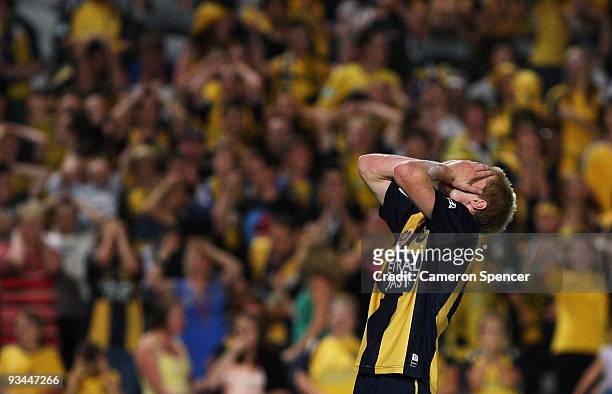 Matthew Simon of the Mariners reacts to an attempted kick at goal during the round 16 A-League match between the Central Coast Mariners and the Perth...