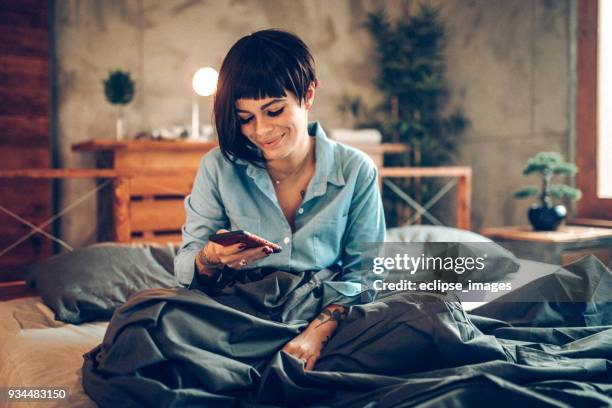 lonely lesbian girl in bed - lesbians bed stock pictures, royalty-free photos & images