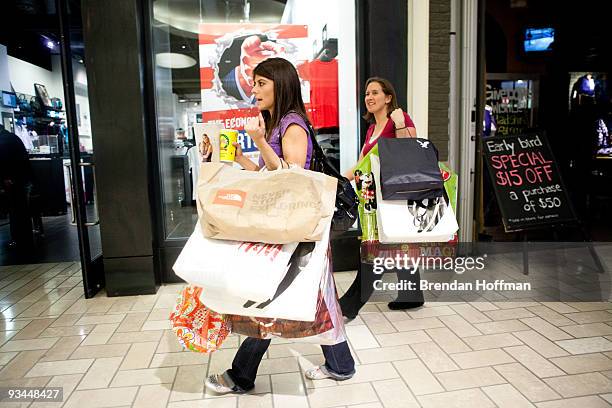 Hannah Craig of Memphis, Tennessee and Jeni Brown of Haymarket, Virginia, get an early start on their holiday gift-buying at Tyson's Corner Center on...