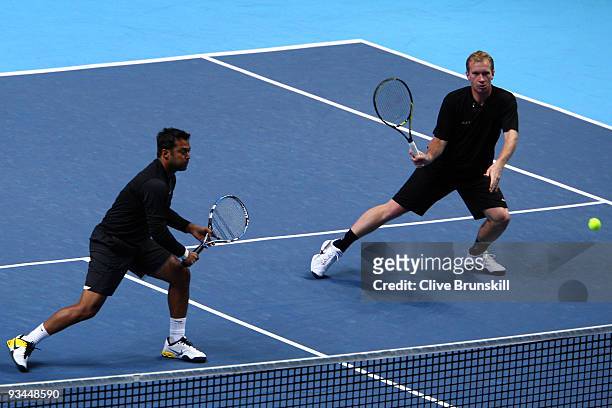 Leander Paes of India plays with Lukas Dlouhy of Czech Republic during the men's doubles round robin match against Max Mirnyi of Belarus and Andy Ram...