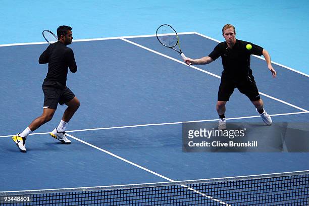 Leander Paes of India plays with Lukas Dlouhy of Czech Republic during the men's doubles round robin match against Max Mirnyi of Belarus and Andy Ram...