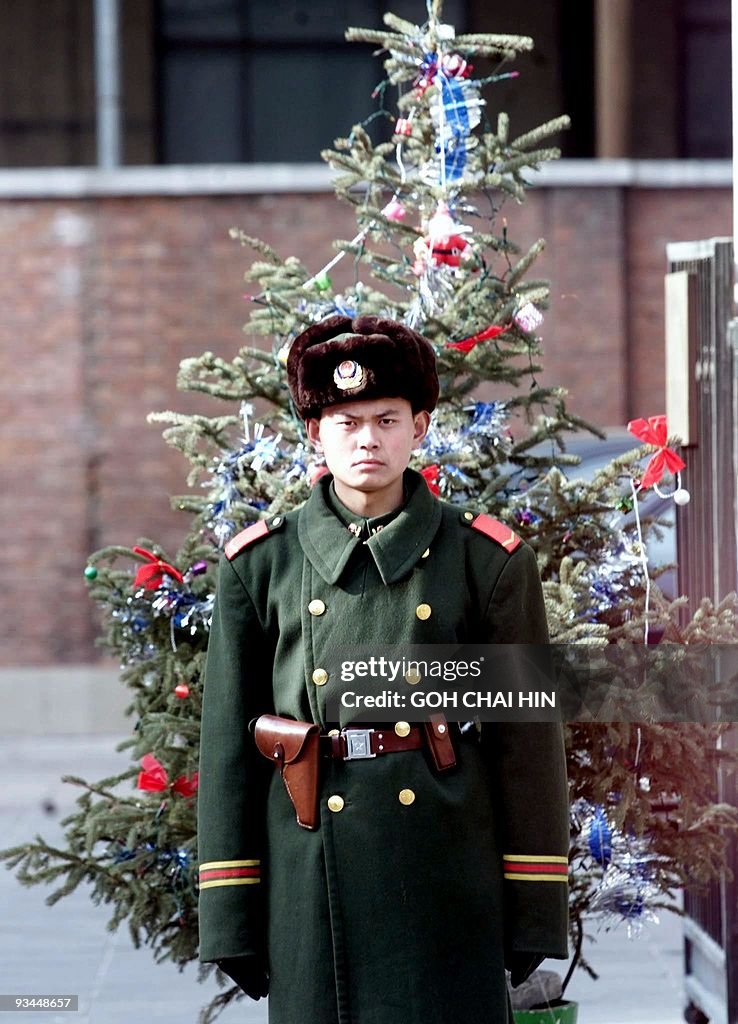 A Chinese People's Armed policeman stand