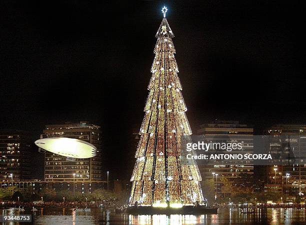 The Pax Rio dirigible , used by the military police to patrol the city, flies during the inauguration of the 82-meter tall Christmas Tree 30 November...
