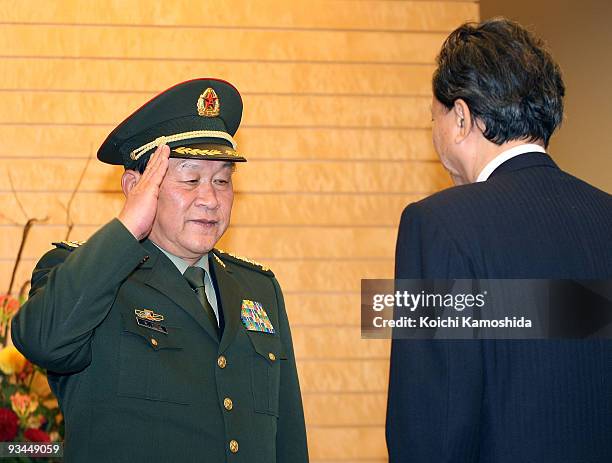 Chinese Defence Minister Liang Guanglie meets with Japanese Prime Minister Yukio Hatoyama prior to their meeting at Hatoyama's official residence on...