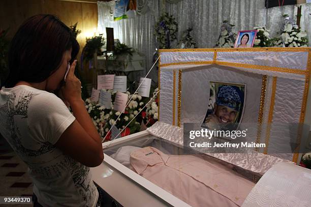 Relative of a journalist among 57 people massacred in the southern Philippine town of Ampatuan in Maguindanao is seen at a wake held for the murdered...