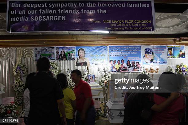 Relatives, friends and supporters of journalists among 57 people massacred in the southern Philippine town of Ampatuan in Maguindanao attend a wake...