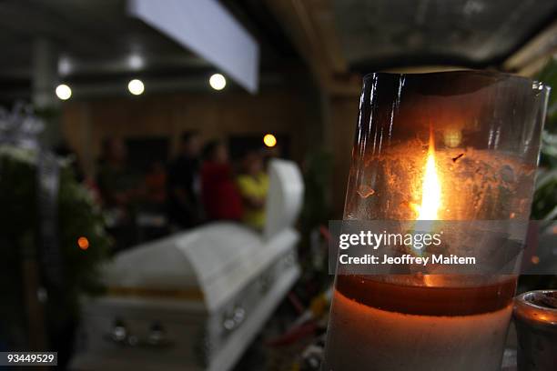 Relatives, friends and supporters of journalists, among 57 people massacred in the southern Philippine town of Ampatuan in Maguindanao, attend a wake...