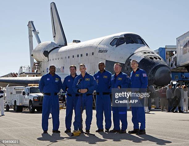The crew of the space shuttle Atlantis speak to the press after they landed November 27, 2009 at Kennedy Space Center in Florida at the end of an...