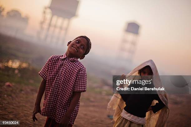 Year old Shyam Babu looks on as he plays outside his home near the Union Carbide factory on November 27, 2009 in Bhopal, India. Twenty-five years...