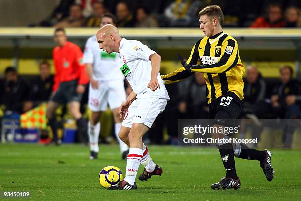 Manuel Junglas of Aachen tackles Nils-Ole Book of Ahlen during the second Bundesliga match between Alemannia Aachen and Rot Weiss Ahlen at the Tivoli...