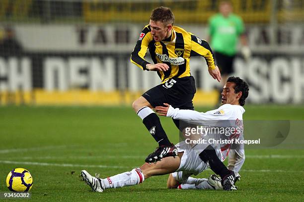 Tim Gorschlueter of Ahlen tackles Manuel Junglas of Aachen during the second Bundesliga match between Alemannia Aachen and Rot Weiss Ahlen at the...