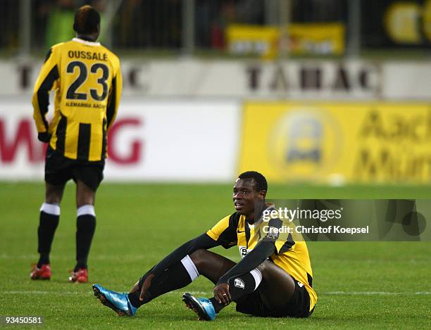 Hervé Oussalé and Seyi Olajengbesi of Aachen look dejected after losing 0-2 the second Bundesliga match between Alemannia Aachen and Rot Weiss Ahlen...